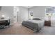 Serene primary bedroom with plush carpeting, neutral decor, and ample natural light at 8007 Sw 135Th Loop, Ocala, FL 34473