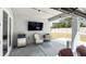 Covered patio with a TV for outdoor entertainment at 8007 Sw 135Th Loop, Ocala, FL 34473