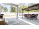 Outdoor patio with a gazebo, dining set, and ample space for relaxation and entertainment at 8007 Sw 135Th Loop, Ocala, FL 34473