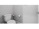 Simple and clean half-bathroom featuring a standard toilet, and light grey paint at 8007 Sw 135Th Loop, Ocala, FL 34473
