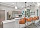 Well-equipped community kitchen with stainless steel appliances and bar stool seating at 1833 Fulfillment Dr, Kissimmee, FL 34744