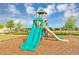 Colorful playground featuring a slide and climbing structure, set against a blue sky at 1833 Fulfillment Dr, Kissimmee, FL 34744