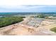 A partially constructed neighborhood set among construction and surrounding green space at 2115 Forage Dr, Kissimmee, FL 34746