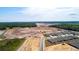 An aerial view showing the construction of future homes within the community at 2115 Forage Dr, Kissimmee, FL 34746
