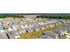 An aerial view highlights the orderly layout and diverse home styles within a modern residential community at 2115 Forage Dr, Kissimmee, FL 34746