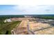 Aerial view of the development showing homes near the construction phase at 2115 Forage Dr, Kissimmee, FL 34746