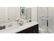 Bathroom featuring double sinks, a modern vanity, and a glass-enclosed shower at 2115 Forage Dr, Kissimmee, FL 34746