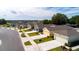 Street view featuring brand new homes with driveways, garages, and landscaping on a sunny day at 2115 Forage Dr, Kissimmee, FL 34746