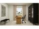 Contemporary office space with a wood desk, office chair, black bench, and glass storage unit at 2157 Albatross Nest Dr, Bartow, FL 33830