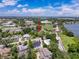 Aerial shot of property with nearby lakes and green surroundings, ideal for outdoor activities and relaxation at 800 W Lake Elbert Ne Dr, Winter Haven, FL 33881