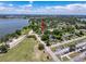 The overhead neighborhood perspective emphasizes its quiet residential area, showcasing its location near park and lake, enhancing appeal at 800 W Lake Elbert Ne Dr, Winter Haven, FL 33881