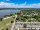 A picturesque aerial view of the neighborhood showcases a lakeside community, featuring nearby amenities and residential charm at 800 W Lake Elbert Ne Dr, Winter Haven, FL 33881