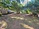 Large backyard with a covered patio at 800 W Lake Elbert Ne Dr, Winter Haven, FL 33881