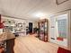 Finished basement featuring vinyl floors, built-in shelving, and access to the full bathroom at 800 W Lake Elbert Ne Dr, Winter Haven, FL 33881