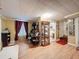 Finished basement featuring vinyl floors, large windows, vintage furnishings, and access to a full bathroom at 800 W Lake Elbert Ne Dr, Winter Haven, FL 33881
