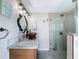 The bathroom features a stand up shower, and a copper bowl sink, offering a unique and stylish touch at 800 W Lake Elbert Ne Dr, Winter Haven, FL 33881