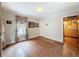 Bedroom with hardwood floors, natural light, and neutral walls, offering a serene and comfortable retreat at 800 W Lake Elbert Ne Dr, Winter Haven, FL 33881
