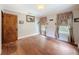 Bedroom with hardwood floors and natural light, creating a peaceful and inviting atmosphere at 800 W Lake Elbert Ne Dr, Winter Haven, FL 33881
