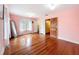 Bedroom showcasing hardwood floors and access to bathroom and hallway at 800 W Lake Elbert Ne Dr, Winter Haven, FL 33881