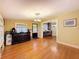 Dining room featuring hardwood floors, natural light, an ornate ceiling light fixture, and vintage furnishings at 800 W Lake Elbert Ne Dr, Winter Haven, FL 33881