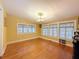 Bright dining room featuring hardwood floors, natural light, and classic features at 800 W Lake Elbert Ne Dr, Winter Haven, FL 33881