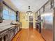Eat-in kitchen with custom cabinets, stainless appliances, hardwood floors, and access to the pantry at 800 W Lake Elbert Ne Dr, Winter Haven, FL 33881