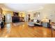 Inviting living room featuring hardwood floors, a classic fireplace, and ample natural light at 800 W Lake Elbert Ne Dr, Winter Haven, FL 33881
