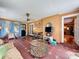 Comfortable sitting room with unique tile flooring, ample natural light, and vintage-inspired decor at 800 W Lake Elbert Ne Dr, Winter Haven, FL 33881