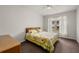 Inviting bedroom with a bright window and cozy floral bedding at 4014 Hemingway Cir # 4014, Haines City, FL 33844
