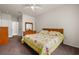 Bedroom with neutral walls and carpet, a ceiling fan, and two dressers at 4014 Hemingway Cir # 4014, Haines City, FL 33844