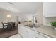 Open kitchen area with stainless steel sink, and view to the dining and living area at 4014 Hemingway Cir # 4014, Haines City, FL 33844