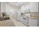Functional kitchen with matching white appliances, white cabinets, and washer/dryer area at 4014 Hemingway Cir # 4014, Haines City, FL 33844