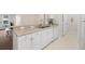 Kitchen with white cabinets, ample counter space, and modern appliances at 4014 Hemingway Cir # 4014, Haines City, FL 33844