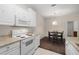 Clean kitchen with white appliances, cabinets, and an adjacent dining area at 4014 Hemingway Cir # 4014, Haines City, FL 33844