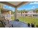 Relax on this covered patio with a view of the landscaped grounds at 4014 Hemingway Cir # 4014, Haines City, FL 33844