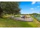 Community playground with slides, swings, and lake view at 4014 Hemingway Cir # 4014, Haines City, FL 33844