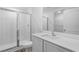 Bright bathroom featuring a glass-enclosed shower and modern vanity at 1 Zinnia E Ln, Poinciana, FL 34759