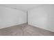 Neutral toned carpeted bedroom with overhead lighting at 1 Zinnia E Ln, Poinciana, FL 34759