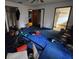 Bedroom featuring a blue carpet, three door frames, a ceiling fan, and a white ceiling at 401 Pine Dr, Sanford, FL 32773