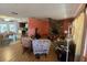 Inviting living room featuring a cozy stone fireplace and hardwood floors, bathed in natural light at 401 Pine Dr, Sanford, FL 32773