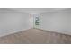 Bedroom with neutral walls, carpet flooring, and natural light from the window at 414 Caribbean Ct, Poinciana, FL 34759