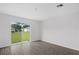 Bright room with sliding glass door that provides access to backyard with green space at 414 Caribbean Ct, Poinciana, FL 34759