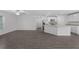 Open-concept living area showcasing kitchen, modern flooring, and ample natural light at 414 Caribbean Ct, Poinciana, FL 34759