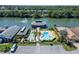 An aerial view of the community pool and clubhouse with water access at 492 Caribbean Dr, Lakeland, FL 33803