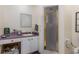Simple bathroom with a walk-in shower and a vanity at 492 Caribbean Dr, Lakeland, FL 33803