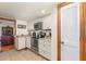 Kitchen with white cabinets, stainless steel appliances, and convenient pantry access at 492 Caribbean Dr, Lakeland, FL 33803