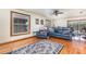 Spacious living room showcasing hardwood floors, windows, and sliding door access to the exterior at 492 Caribbean Dr, Lakeland, FL 33803