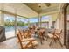 Covered patio dining area with views of the lake at 492 Caribbean Dr, Lakeland, FL 33803