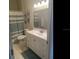 Well-lit bathroom features a modern vanity with ample storage, complemented by stylish coastal decor and finishes at 2057 Swift Rd, Oviedo, FL 32766