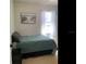 Inviting bedroom featuring a comfortable bed with decorative pillows and soft, sheer curtains for natural light at 2057 Swift Rd, Oviedo, FL 32766